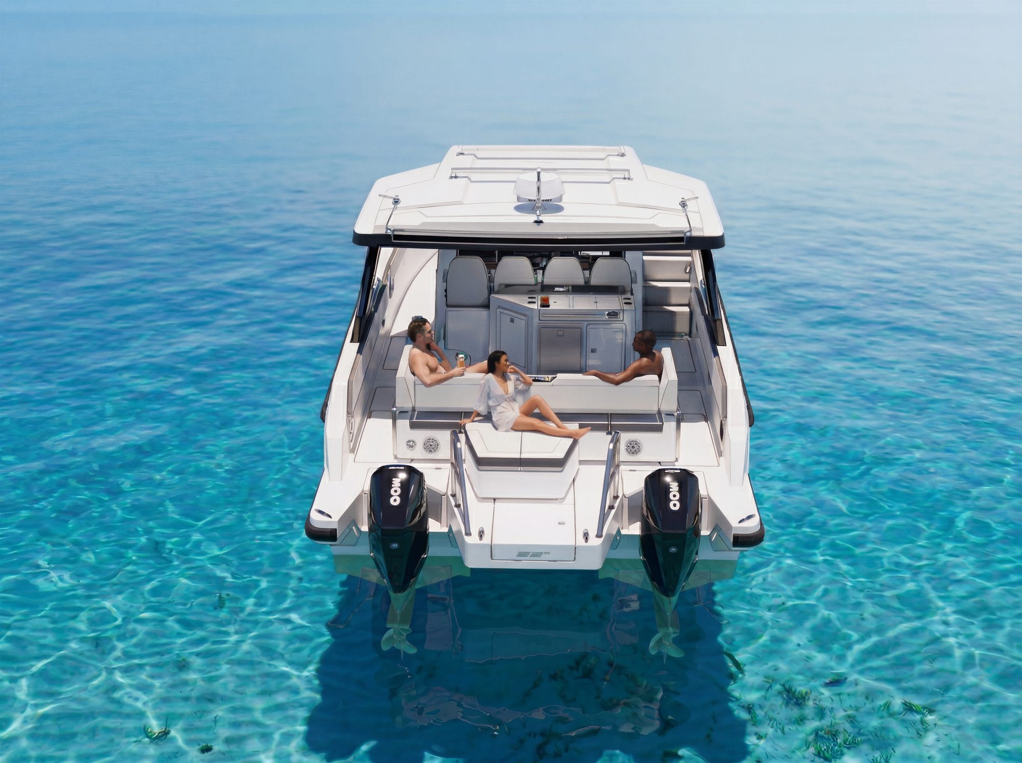 Two people on the aft sun lounger of the 35 Sport