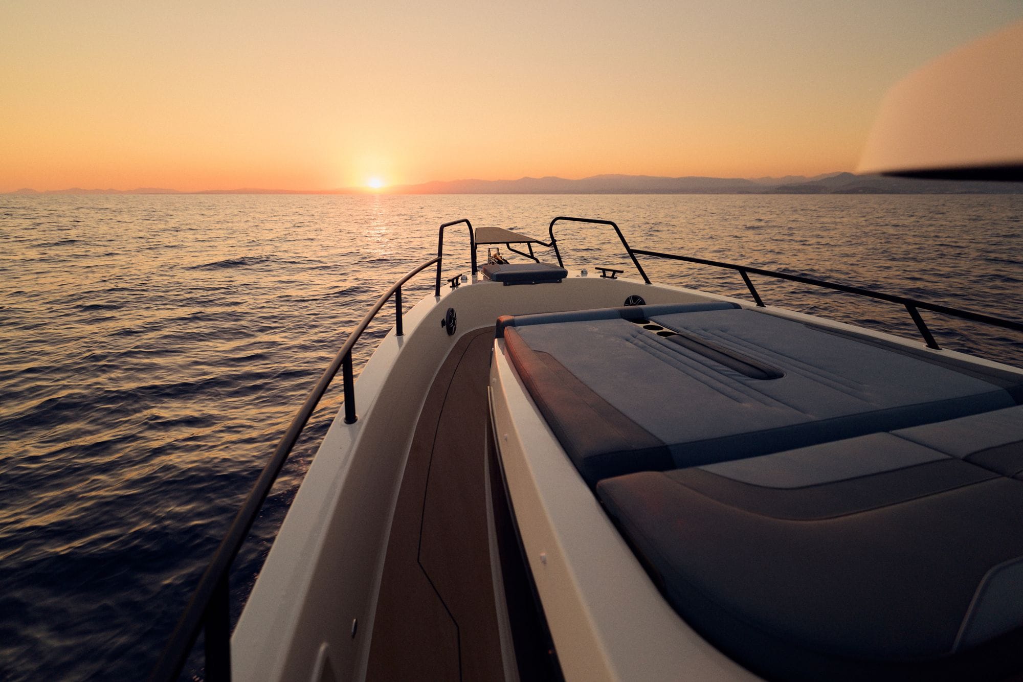 The C38 bow lounge at sunset