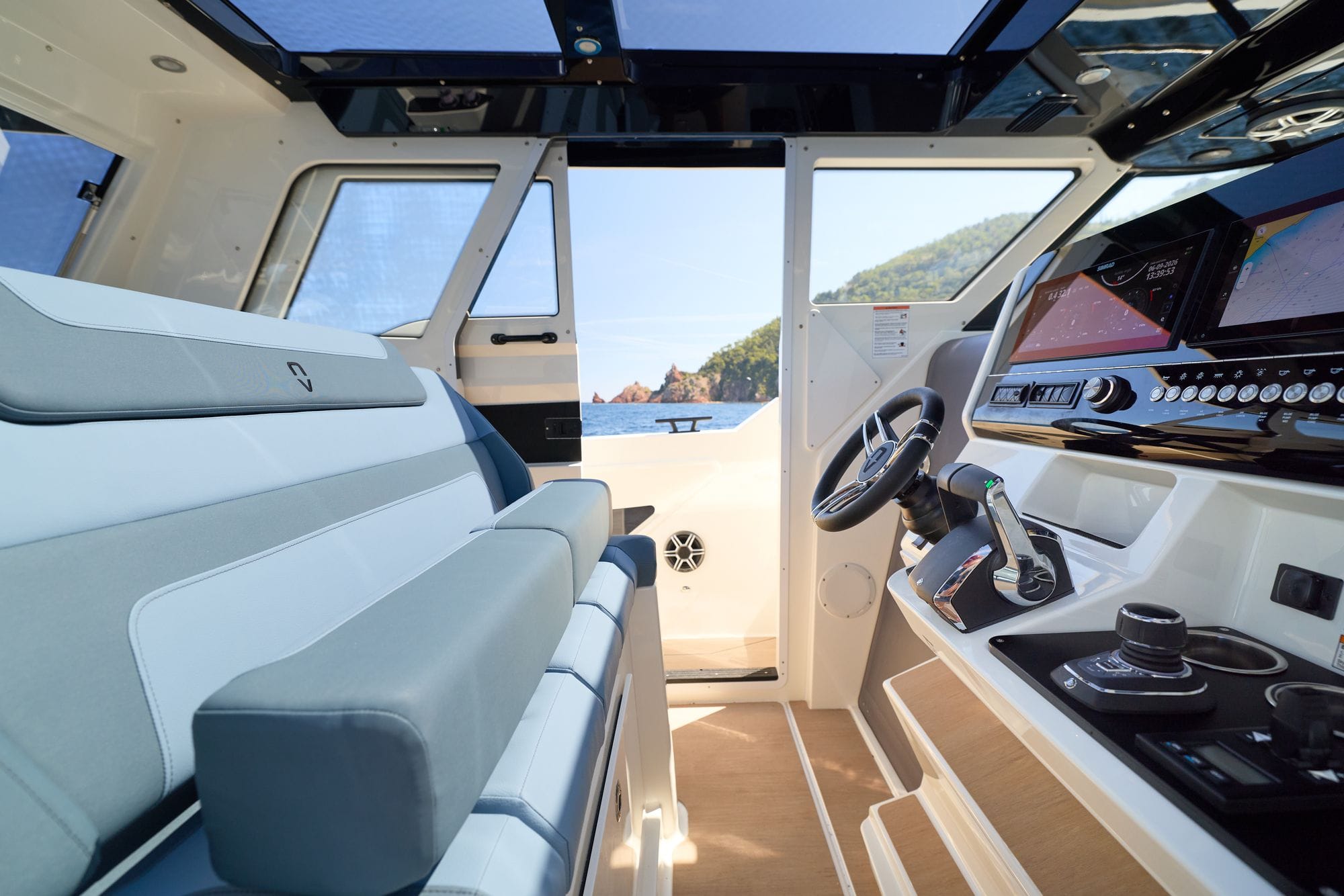 The helm inside the enclosed pilothouse