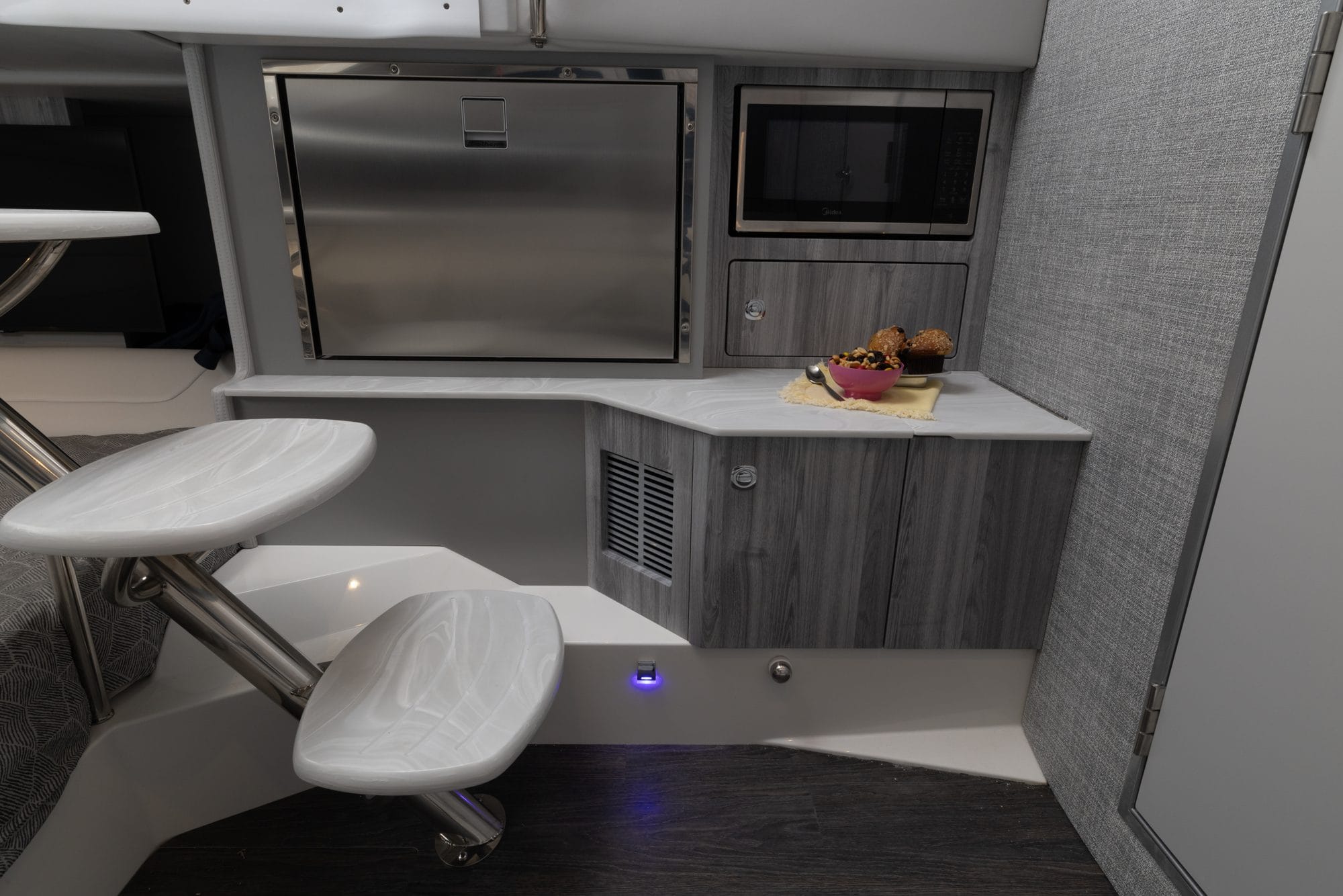 Galley with fridge, microwave and fold-out table