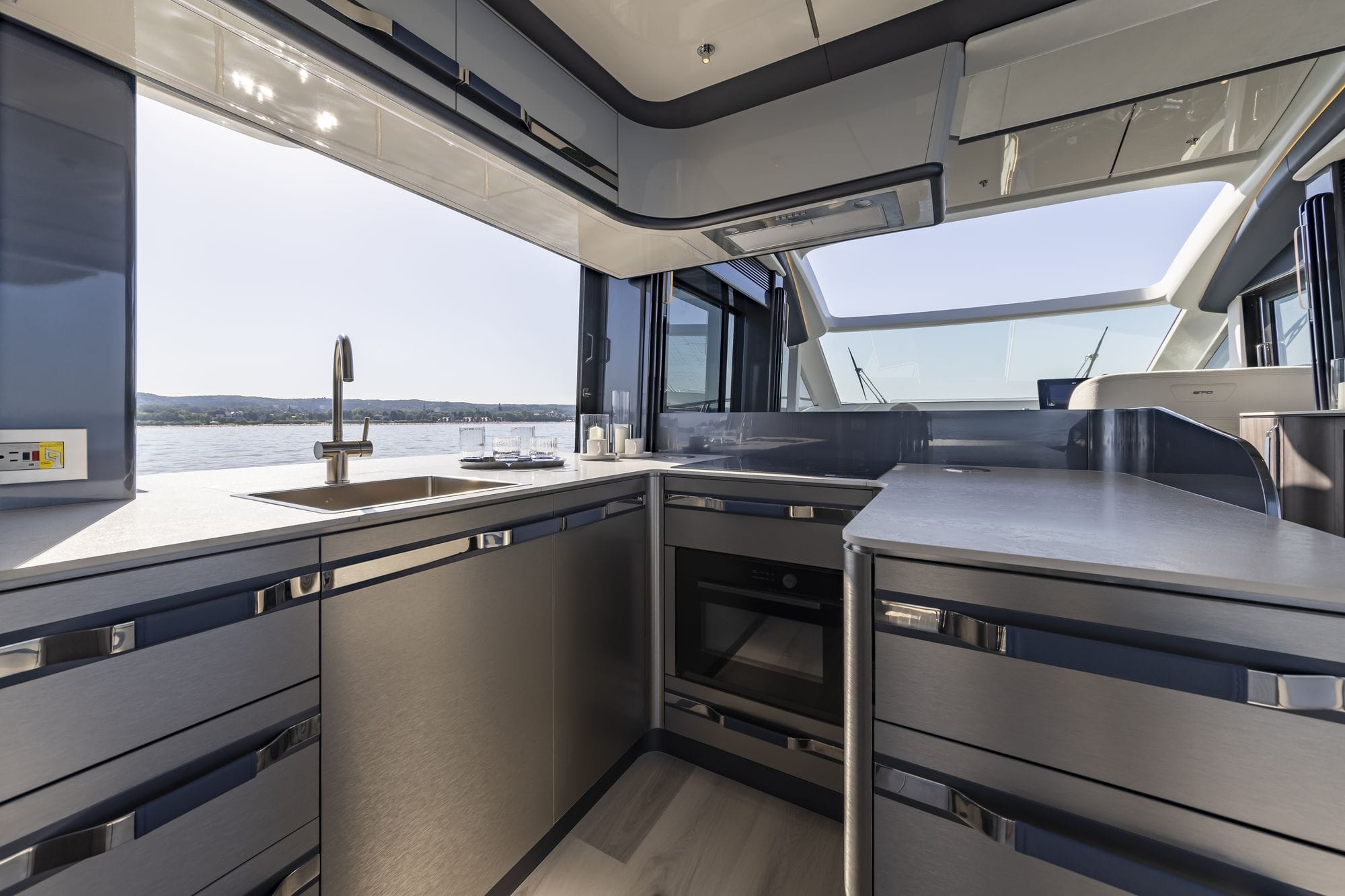 The galley with the cooktop and windows to the side deck