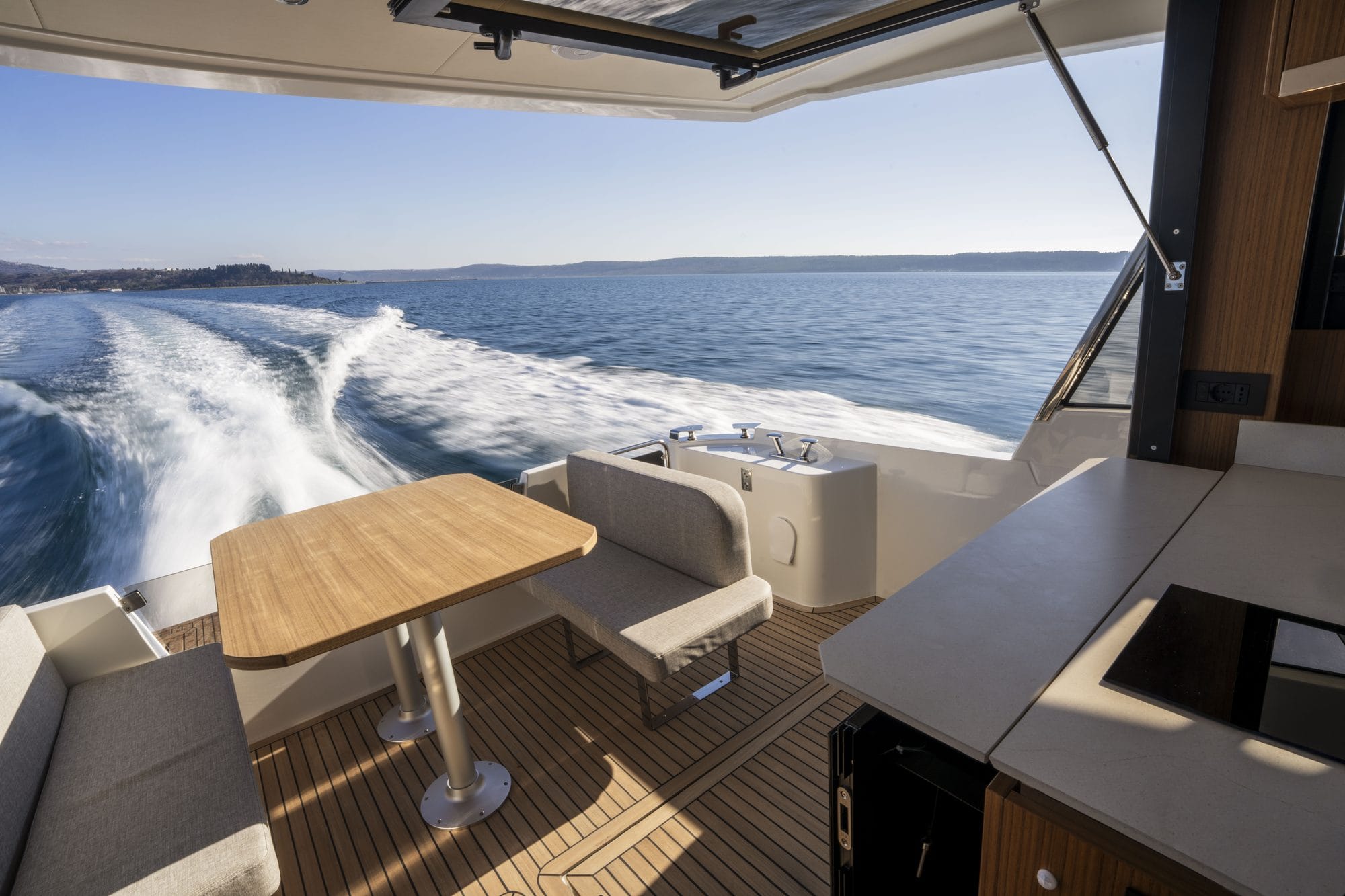 Cockpit table and seating looking aft from the galley over the wake