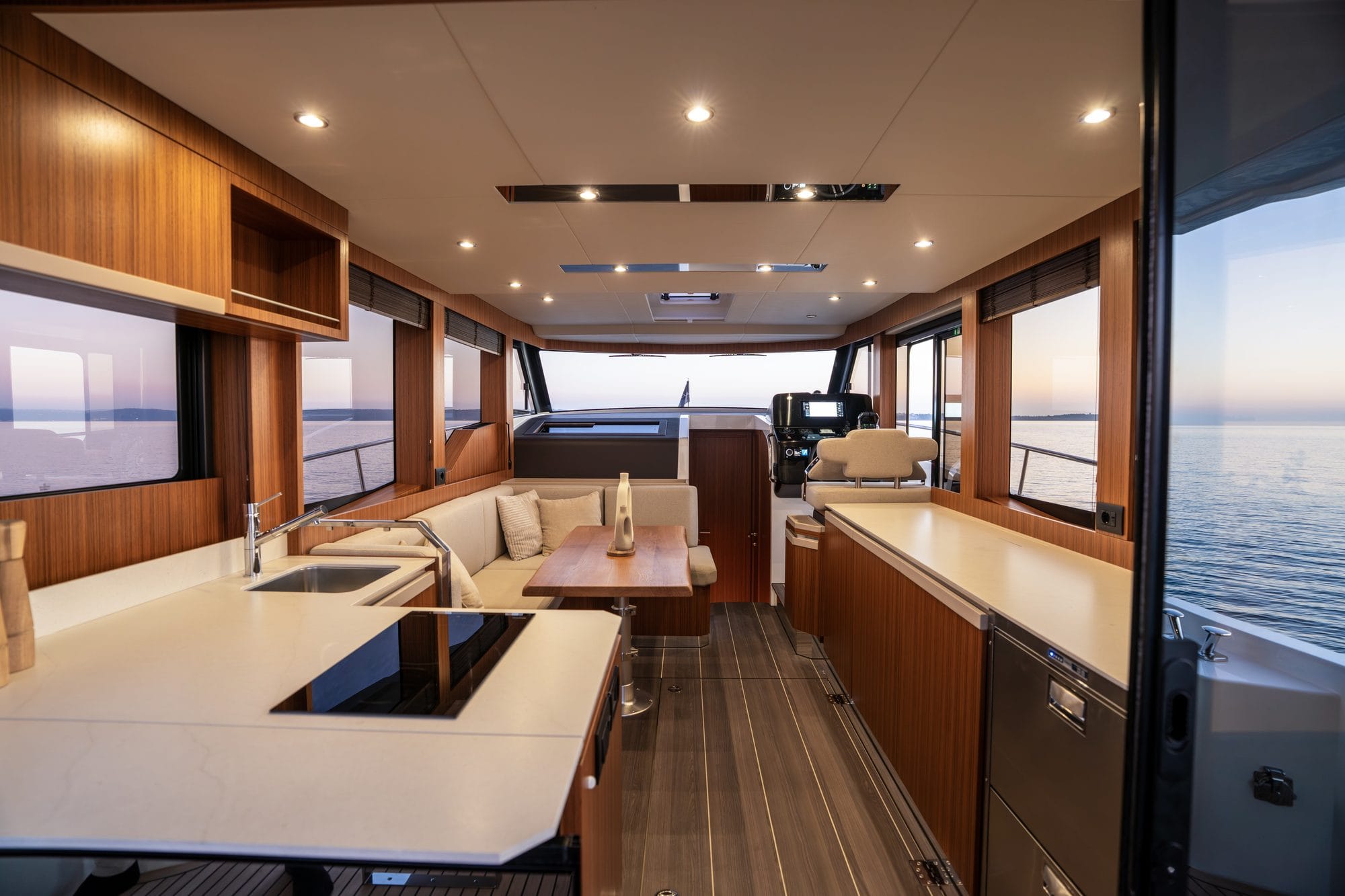 Saloon with the galley to port and the dinette forward