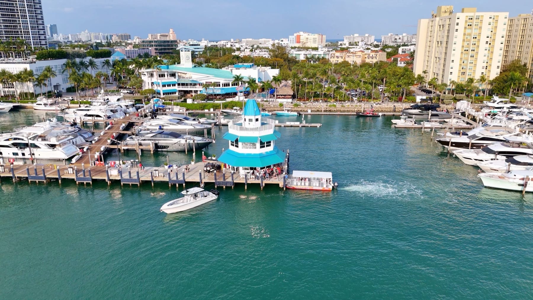 Miami marina with boats along the docks and a dockmaster tower