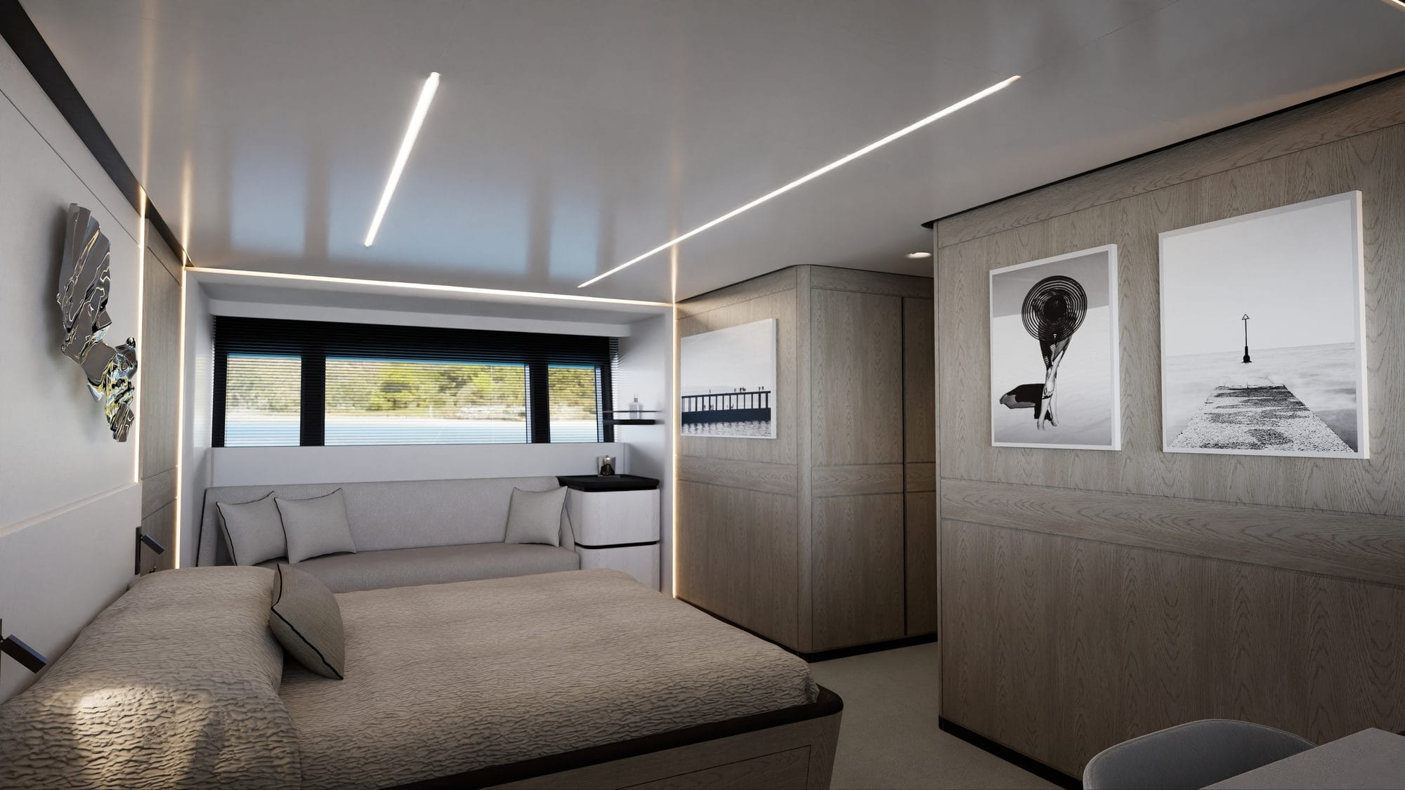 Lower-deck suite with a double bed and framed photographs